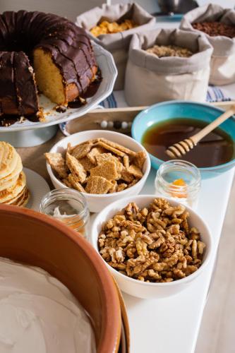 a table topped with bowls of food and desserts at Belvedere Luxury Apartments & Spa in Plakias