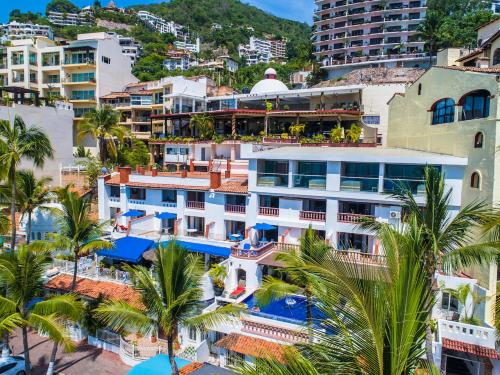 an aerial view of a resort with palm trees and buildings at Marboka Hotel & Suites in Puerto Vallarta