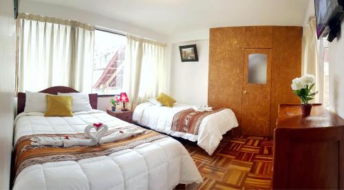 Postel nebo postele na pokoji v ubytování Hostal Comarca Imperial