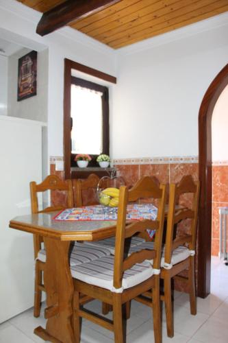 a dining room table and chairs in a kitchen at Casa do Facho in Vila Chã