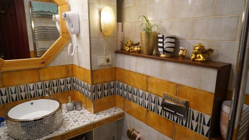 a bathroom with a sink and a mirror at 160 degrees in Tbilisi City