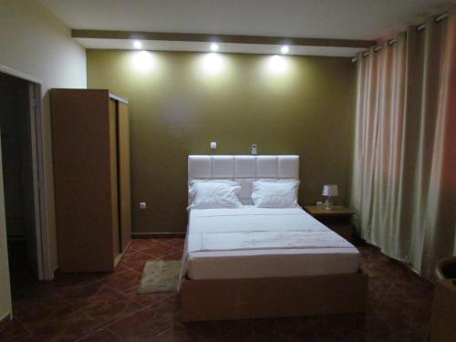 Postel nebo postele na pokoji v ubytování Residêncial Carlos Carvalho