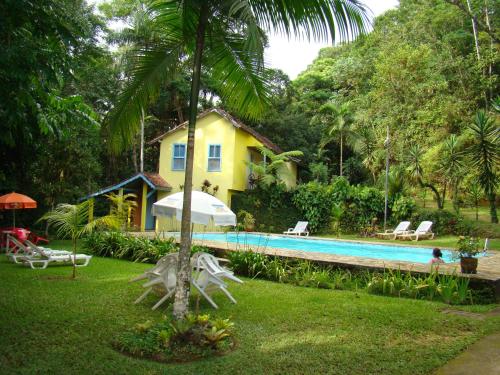 The swimming pool at or close to Pousada Arboretum