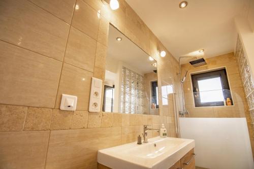 a bathroom with a sink and a mirror at La Bella Vista in Roquebrune-Cap-Martin