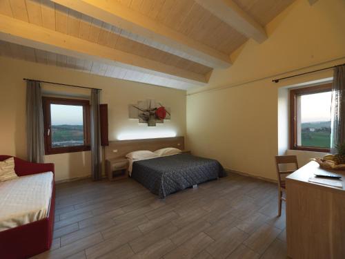 מיטה או מיטות בחדר ב-Hotel Ristorante Cantina Langelina