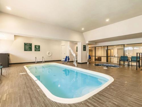 a large pool with blue water in a building at La Quinta by Wyndham Glenwood Springs in Glenwood Springs
