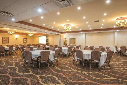 a banquet hall with tables and chairs in a room at Mountain Valley Inn & Suites in Silverthorne