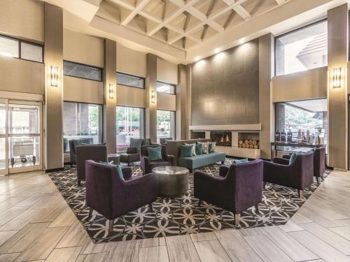a lobby with couches and chairs on a rug at La Quinta by Wyndham Glenwood Springs in Glenwood Springs