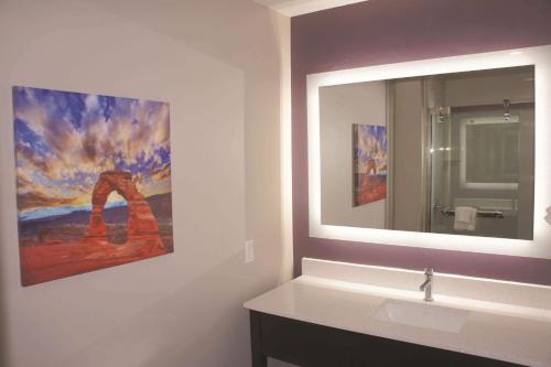 a bathroom with a sink and a mirror at La Quinta by Wyndham Kanab in Kanab