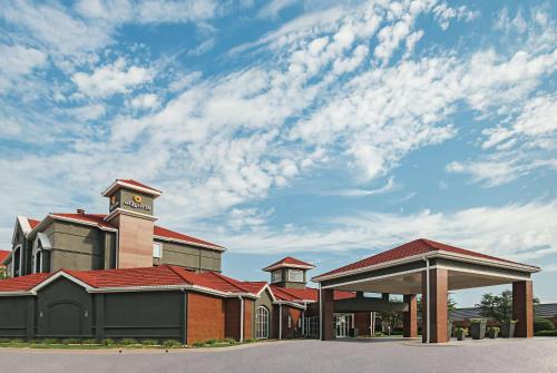 a large building with a clock tower on top of it at La Quinta by Wyndham Fort Worth City View in Fort Worth