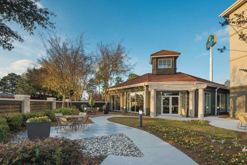 a building with a clock tower on top of it at La Quinta by Wyndham Shreveport Airport in Shreveport