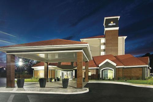 a large building with a clock tower on top at La Quinta by Wyndham Atlanta Conyers in Conyers