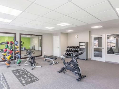 a gym with several exercise bikes and treadmills at La Quinta by Wyndham Denver Tech Center in Greenwood Village