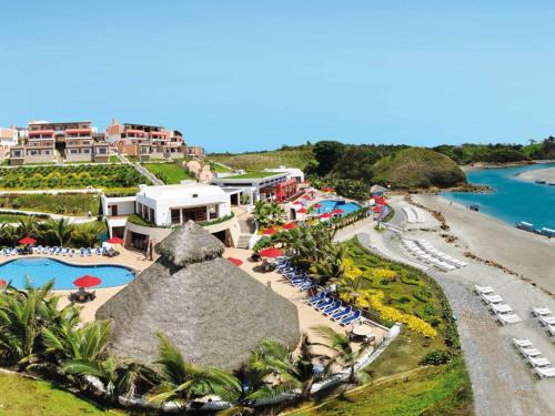 an aerial view of a resort with a pool and a beach at Royal Decameron Mompiche - All Inclusive in Mompiche