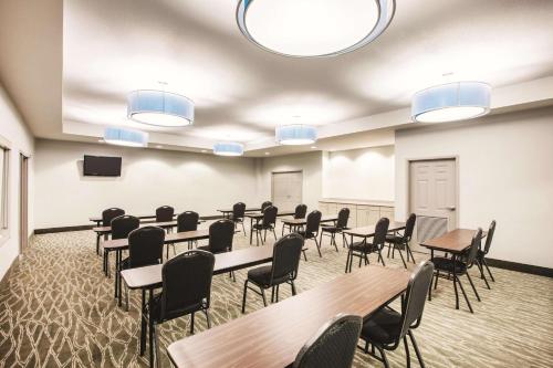 a large room with tables and chairs and lights at La Quinta by Wyndham Mansfield TX in Mansfield
