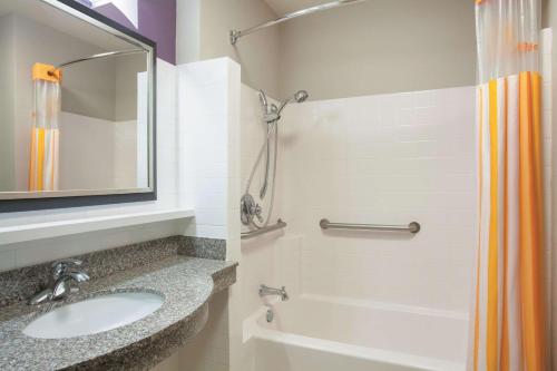 a bathroom with a sink and a shower at La Quinta by Wyndham Fort Walton Beach in Fort Walton Beach