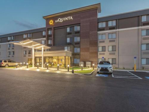 a car parked in a parking lot in front of a hotel at La Quinta by Wyndham Salem NH in Salem