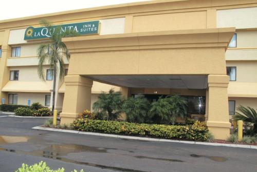 a hotel building with a street sign in front of it at La Quinta by Wyndham Tampa Brandon West in Tampa