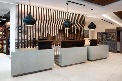 a store lobby with a large metal wall at Hyatt Place San Francisco/Downtown in San Francisco