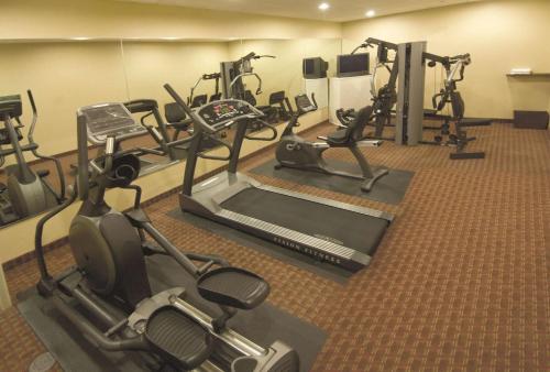 a gym with several treadmills and exercise bikes at La Quinta by Wyndham Marble Falls in Marble Falls