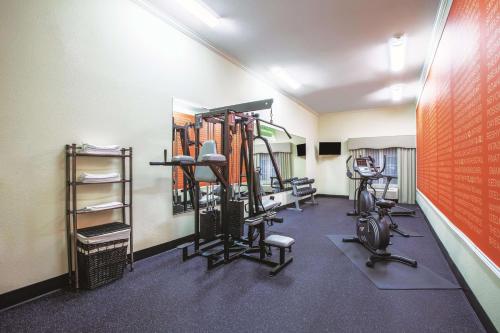 a gym with treadmills and exercise equipment in a room at La Quinta by Wyndham Gainesville in Gainesville