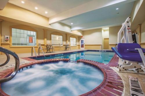a pool in a hotel room with a lap pool at La Quinta by Wyndham Gainesville in Gainesville