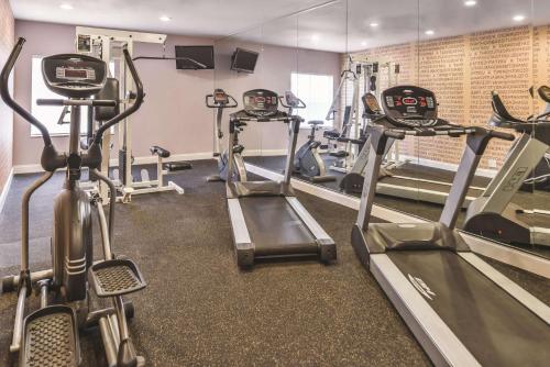a gym with treadmills and elliptical machines at La Quinta by Wyndham Abilene Mall in Abilene