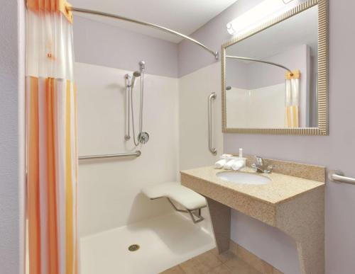 a bathroom with a sink and a shower at La Quinta by Wyndham Corsicana in Corsicana