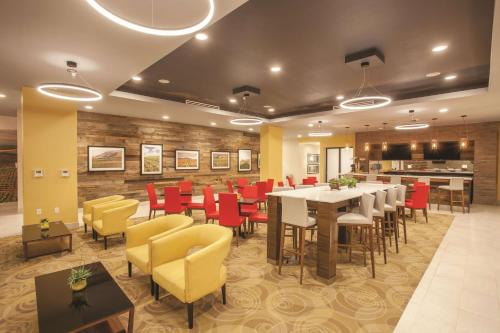 a dining room with a table and chairs at La Quinta by Wyndham Morgan Hill-San Jose South in Morgan Hill