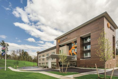 a rendering of the exterior of a building at La Quinta Inn & Suites by Wyndham Clifton Park Saratoga Area 1749 Route 9 in Clifton Park