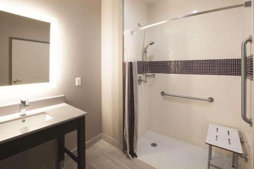 a bathroom with a shower and a sink at La Quinta by Wyndham Kingsville in Kingsville