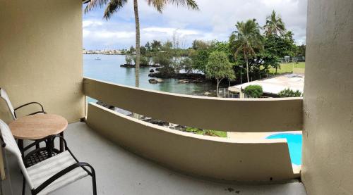a view from a balcony overlooking the ocean at Hilo Reeds Bay Hotel in Hilo