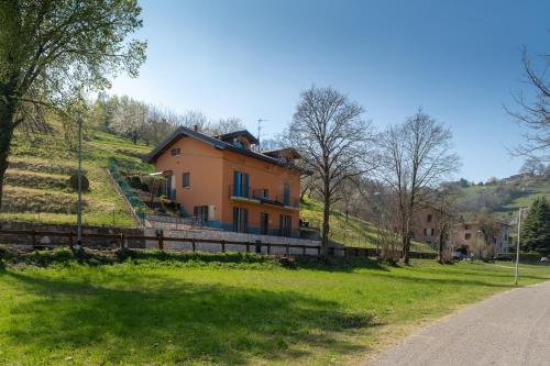 a house on the side of a hill at Villa dei Venti - Comfort Holiday in Bergamo
