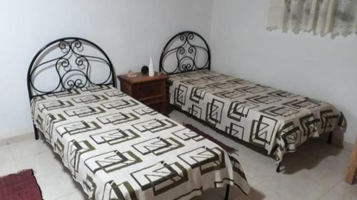 Un pat sau paturi într-o cameră la Pousada Lenda da Montanha
