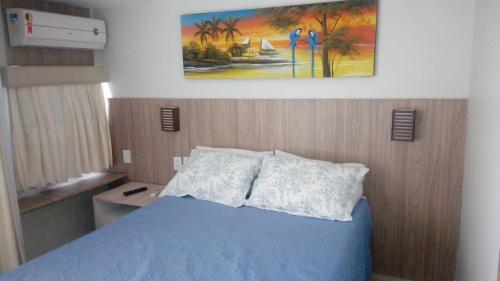 Postel nebo postele na pokoji v ubytování Costeira Praia Flat 204