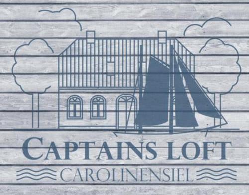 a sign on a wooden wall with a building at 50002 Captains Loft in Carolinensiel