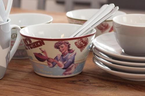 a table with cups and plates and chopsticks on it at 50002 Captains Loft in Carolinensiel