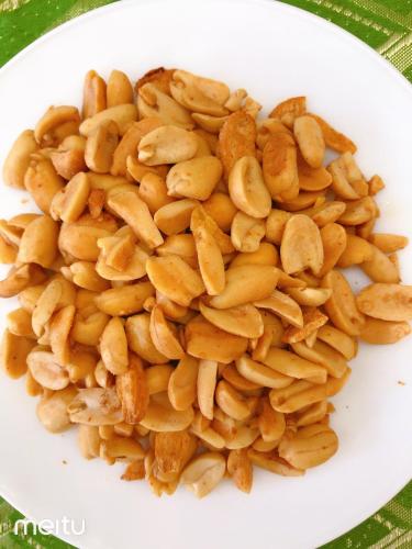 a white plate of nuts on a table at Grand Blue Beach Hotel in Boracay