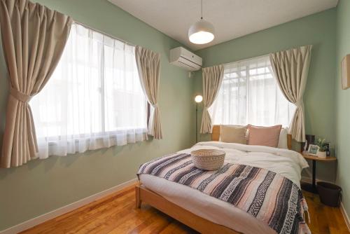 Katil atau katil-katil dalam bilik di Pine House in ARAHA