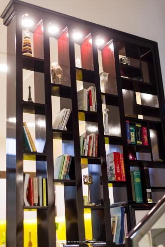 a book shelf filled with lots of books at Lama Homestay in Hue