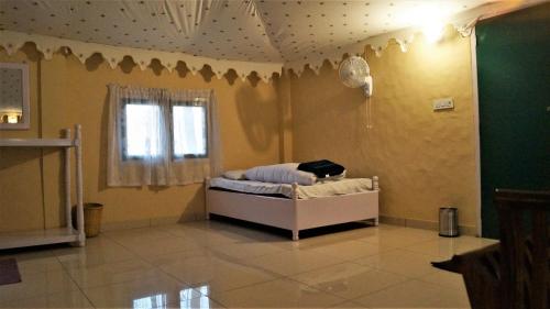 Postel nebo postele na pokoji v ubytování Prakriti Farms