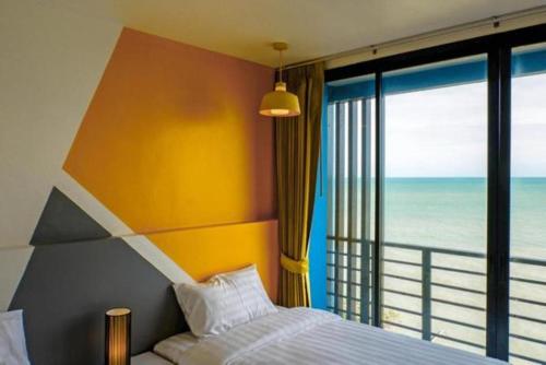 Postel nebo postele na pokoji v ubytování Play Phala Beach Rayong