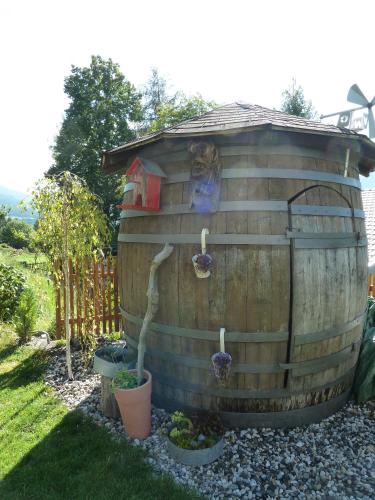a bird house with a cat in it at Haus Lasaun in Bressanone