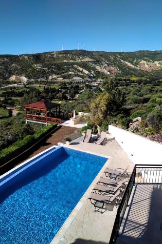 a villa with a swimming pool and a view at Villa HERMIONA in Kouklia