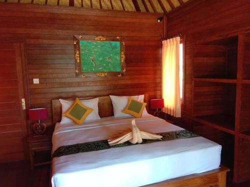 Postel nebo postele na pokoji v ubytování Svaha Nusa Guest House