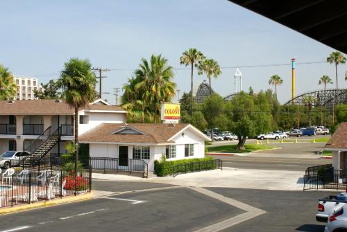 a view of a street with a hotel and a parking lot at Colony Inn in Buena Park