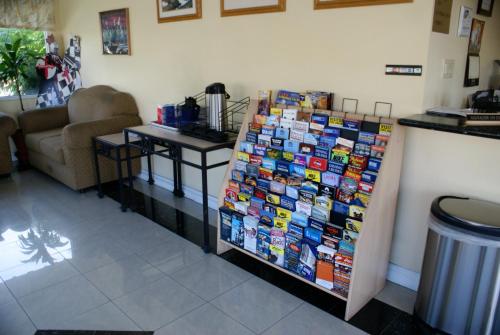 a store with a display of cards on a wall at Colony Inn in Buena Park