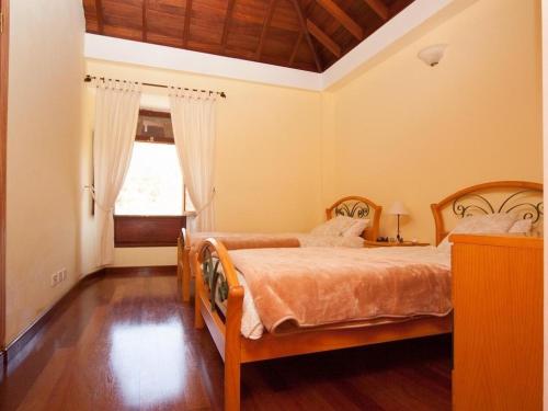 מיטה או מיטות בחדר ב-Casa Rural Lili