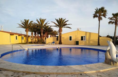 Photo de la galerie de l'établissement Apartamento con piscina y terraza en Ciutadella, Cala en Blanes, à Cala en Blanes