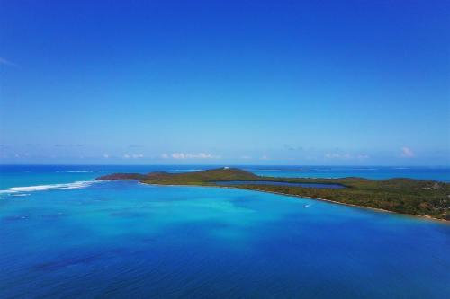 an aerial view of an island in the ocean at Cozy apartment near the beach #1 in Fajardo